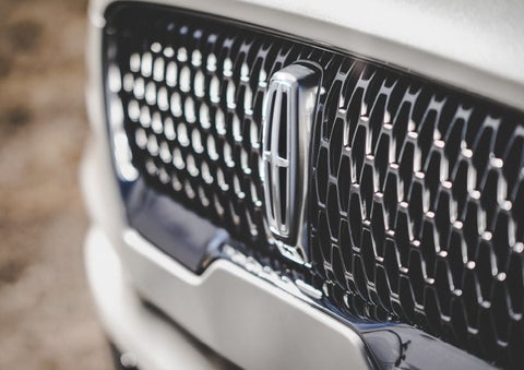 The grille of the 2024 Lincoln Aviator® Reserve model with an eye-catching repeated field of Lincoln Star logo shapes | Magic City Lincoln in Roanoke VA