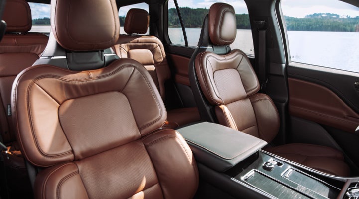 The front row's Perfect Position Seats in a 2024 Lincoln Aviator® Reserve model with Ebony Roast interior | Magic City Lincoln in Roanoke VA